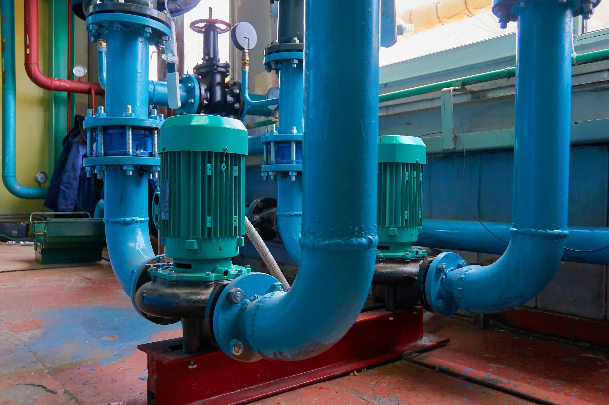 Vertical slot motors on pumps water conduit colored in blue.